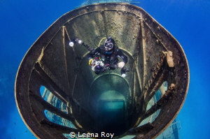 Diver in funnel of Kittiwake wreck by Leena Roy 